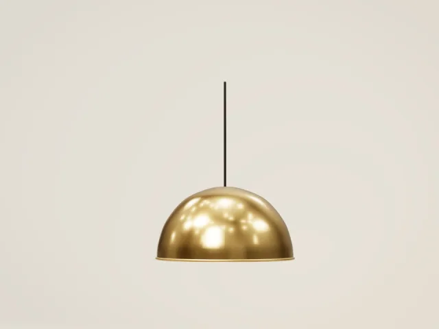 Brass dome pendant light with a warm glow