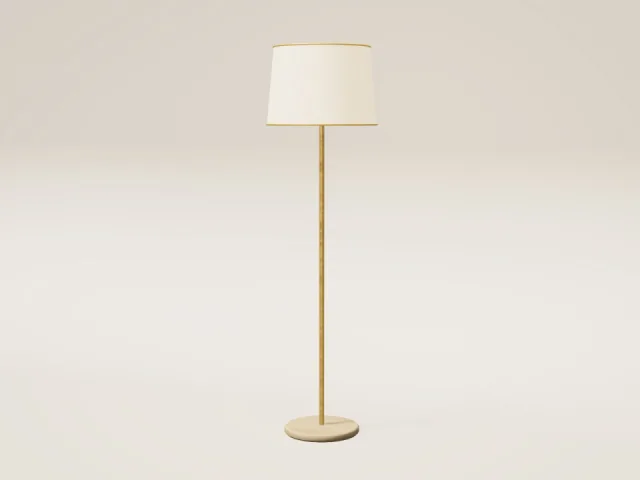 Slim brass floor lamp with linen shade and travertine base